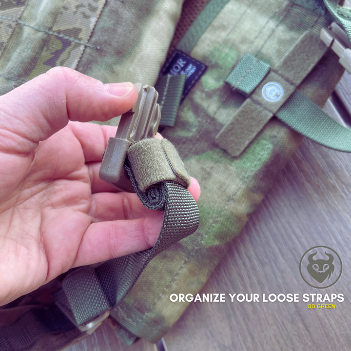 OD green strap keeper on a loose webbing