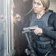 female cop using militaur first responder door stop